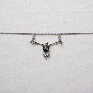 y2k style silver skeleton prisoner pendant necklace